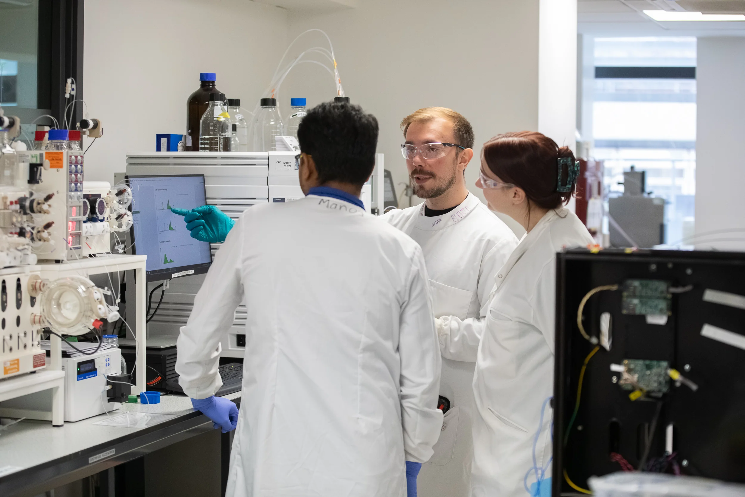 Team members discussing research